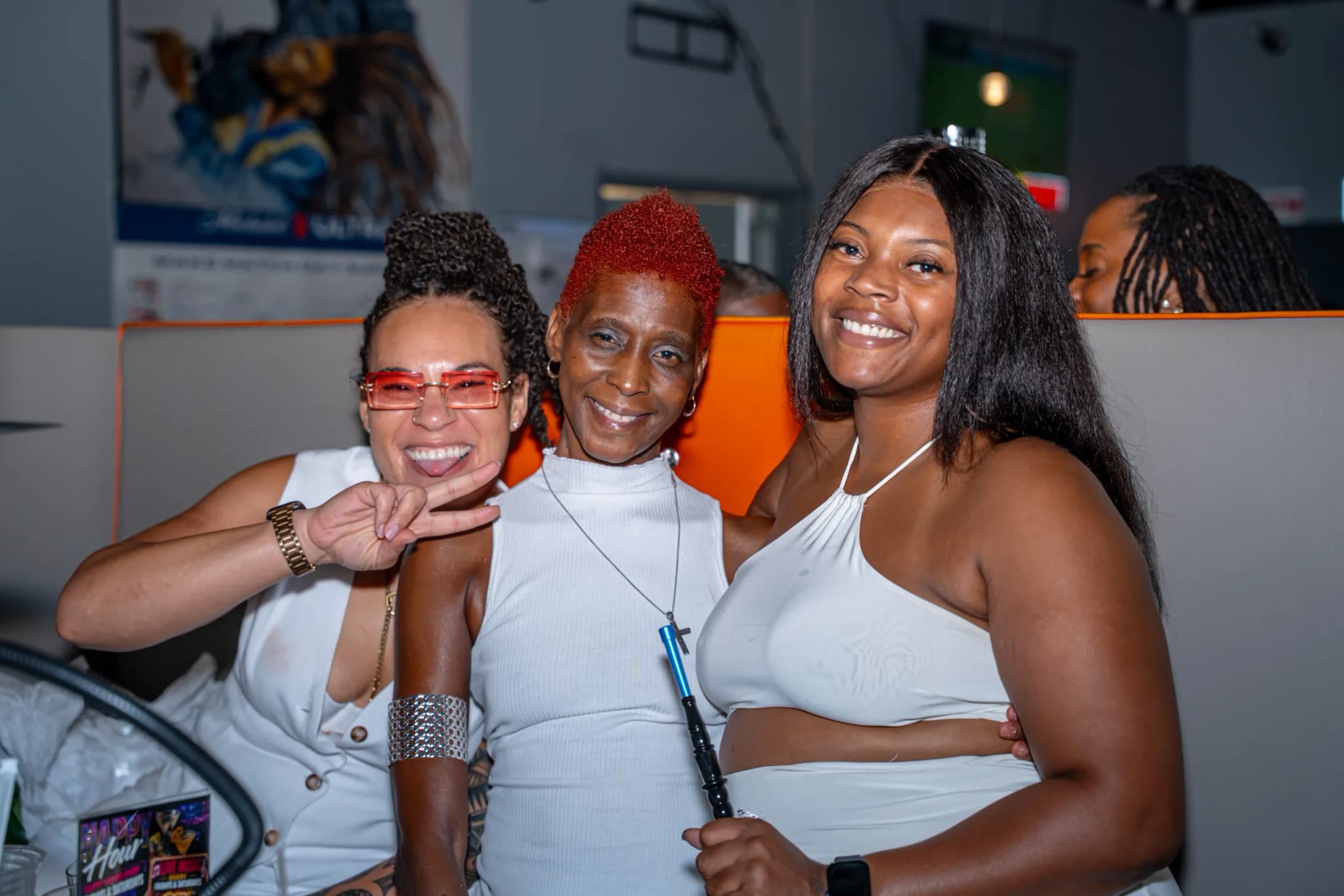 A couple enjoying hookah and the lounge vibe inside Jewlz Bar & Lounge